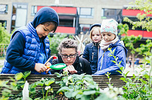 Children investigating a garden.