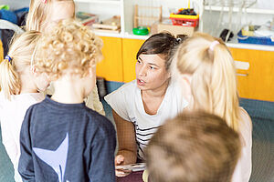 Educator talking to children